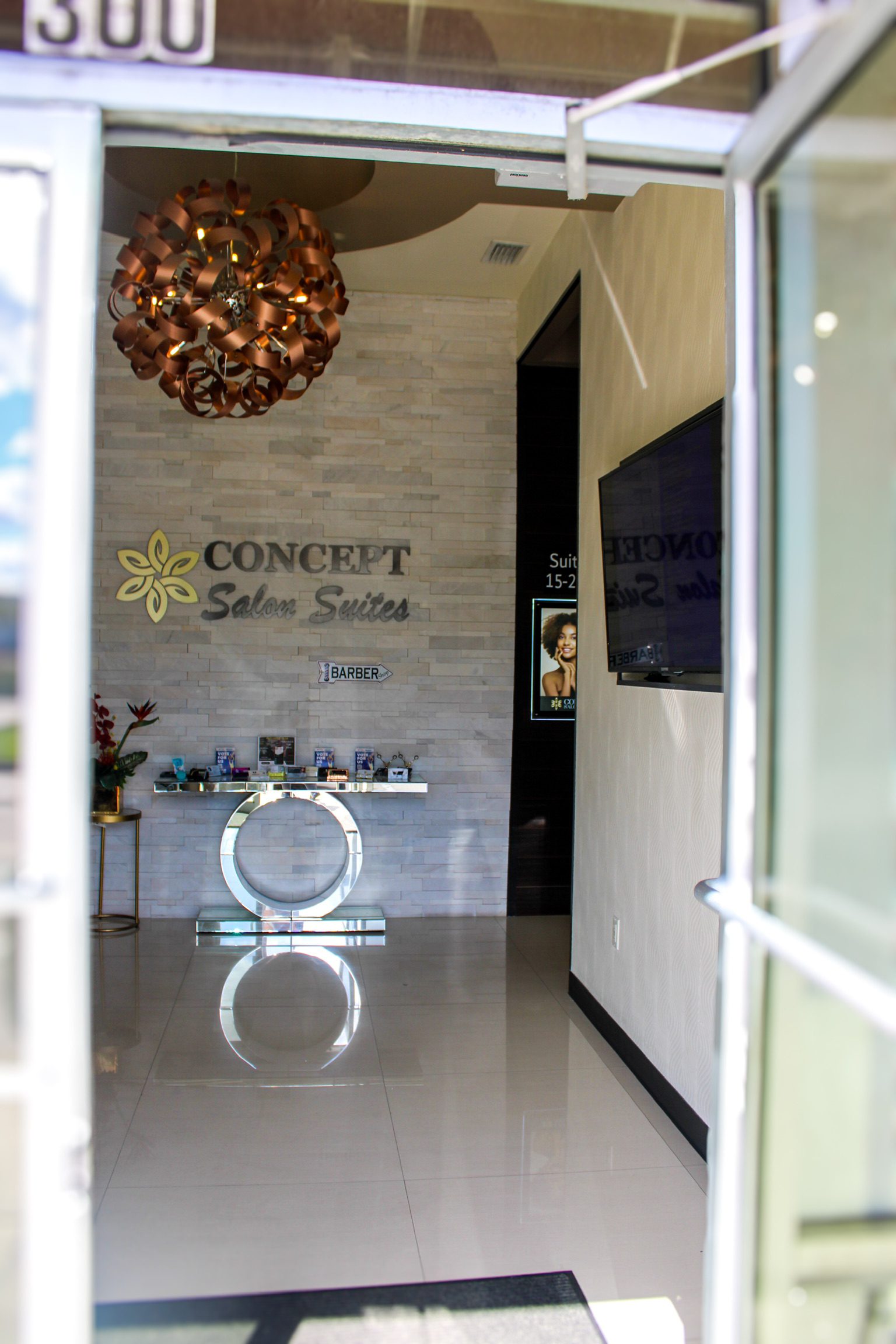 Beauty professional using Booksy at Concept Salon Suites